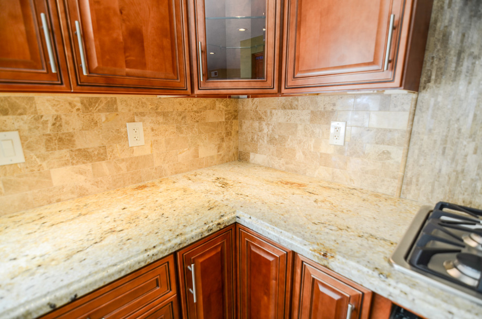 Inspiration for a large timeless u-shaped travertine floor open concept kitchen remodel in Tampa with an undermount sink, raised-panel cabinets, light wood cabinets, granite countertops, beige backsplash, stone tile backsplash, stainless steel appliances, green walls and an island