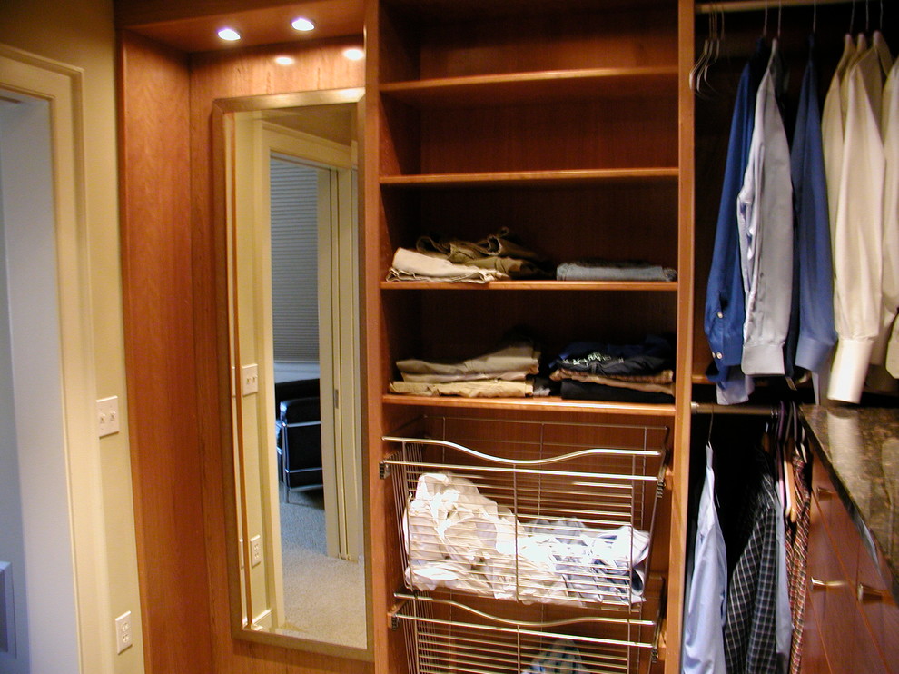 Design ideas for a mid-sized traditional men's dressing room in Providence with shaker cabinets and medium wood cabinets.