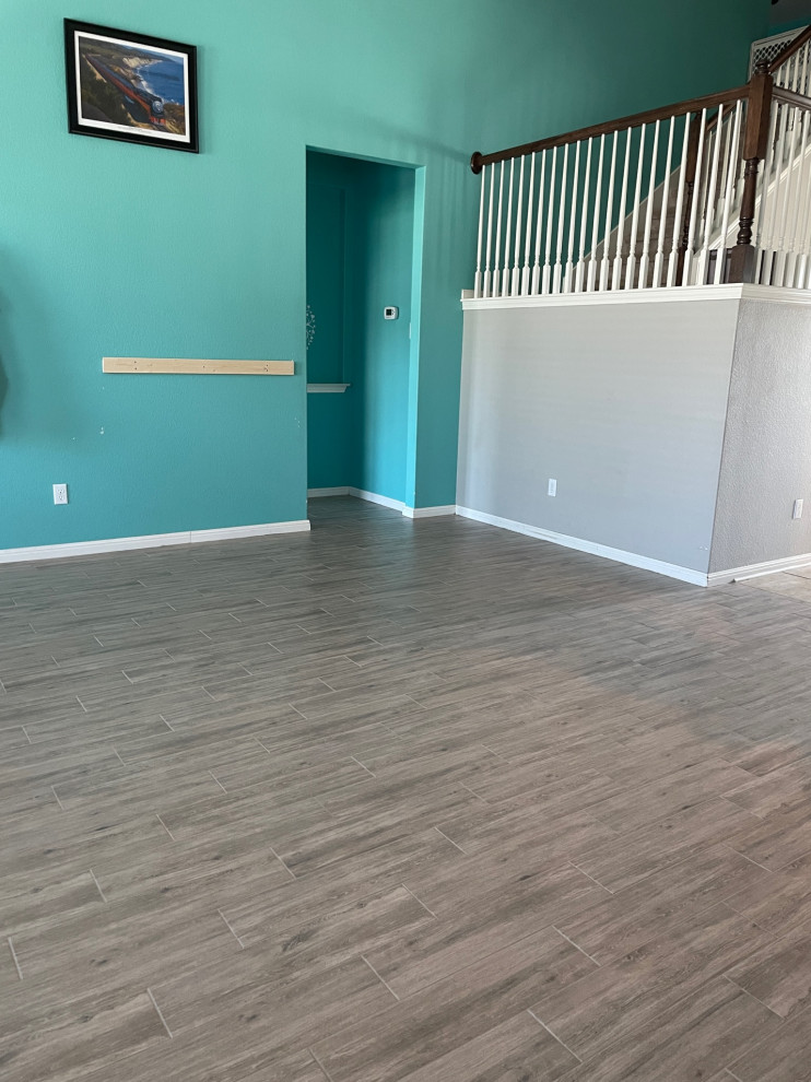 This is an example of a beach style games room in Austin with porcelain flooring.