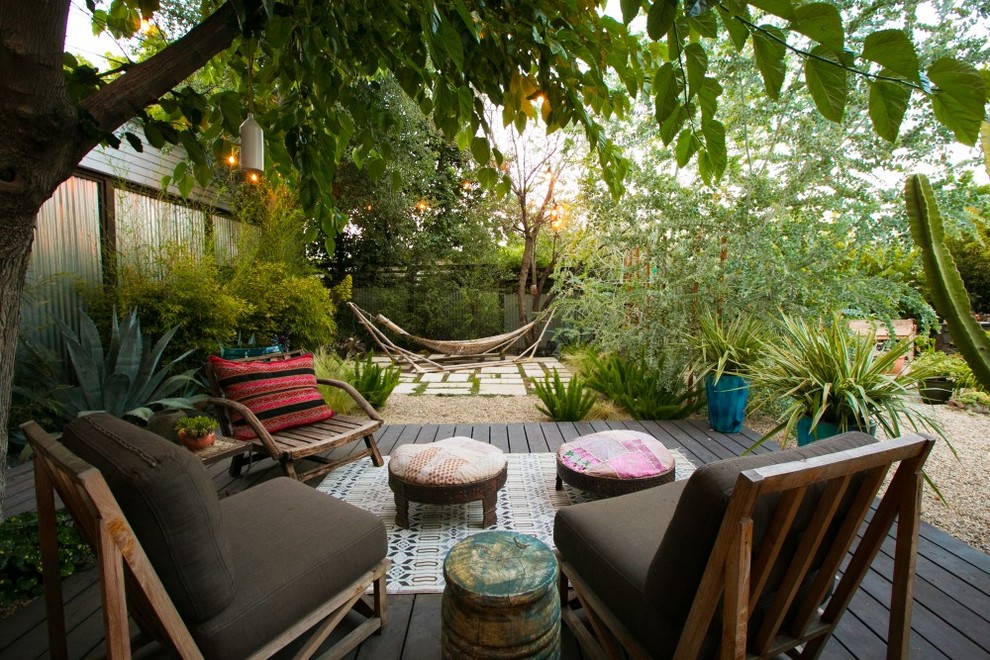 Photo of a mid-sized eclectic backyard partial sun garden in Los Angeles.