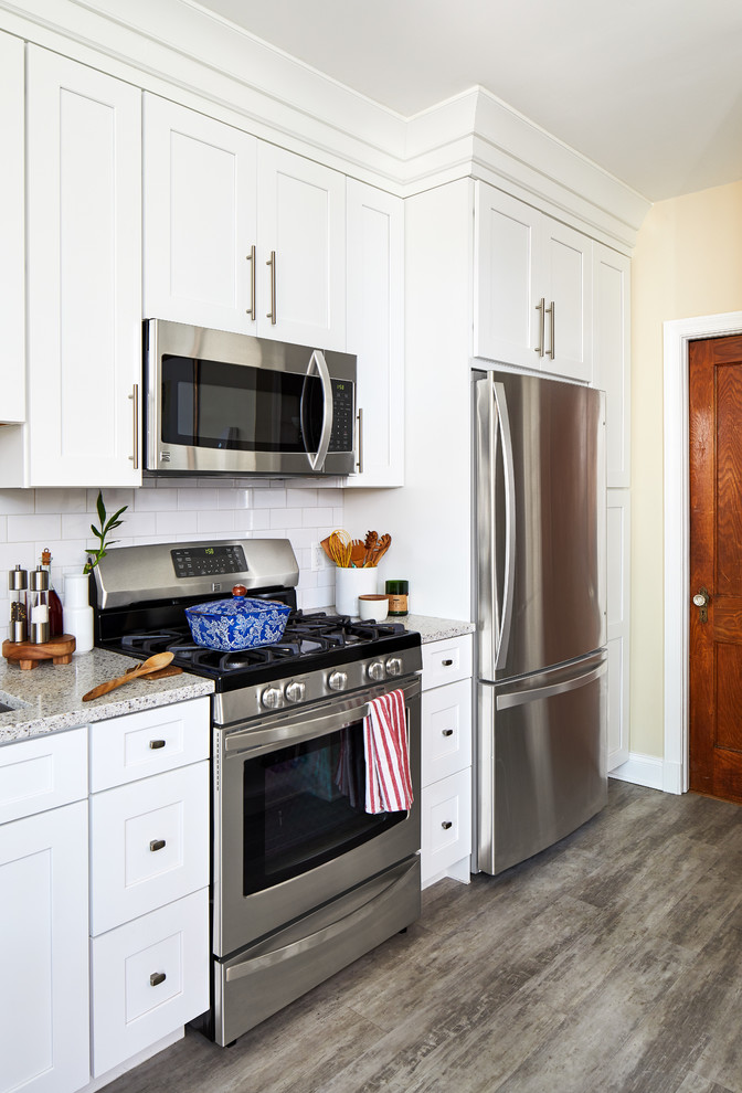 Small transitional galley eat-in kitchen in DC Metro with shaker cabinets, white cabinets, quartz benchtops, white splashback, porcelain splashback and no island.