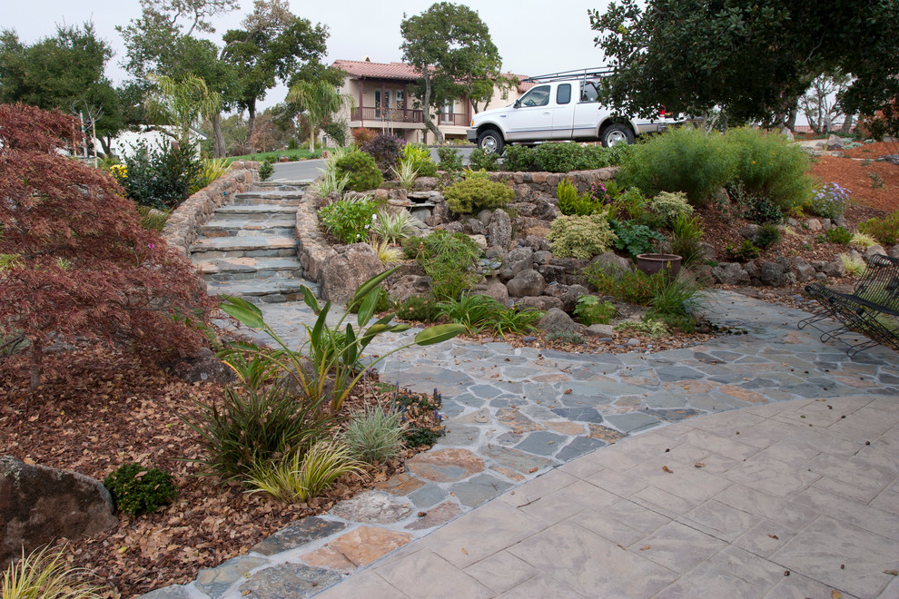 Inspiration for a mid-sized asian front yard garden in San Francisco with with pond and natural stone pavers.
