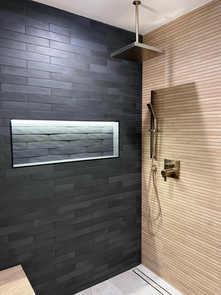 This is an example of a large shower room bathroom in Los Angeles with shaker cabinets, black cabinets, a corner shower, a one-piece toilet, brown tiles, wood-effect tiles, white walls, ceramic flooring, a built-in sink, quartz worktops, grey floors, a sliding door, white worktops, double sinks and a freestanding vanity unit.
