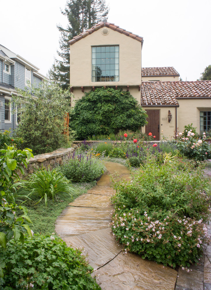 Inspiration for a mediterranean garden in San Francisco with a garden path and natural stone pavers.