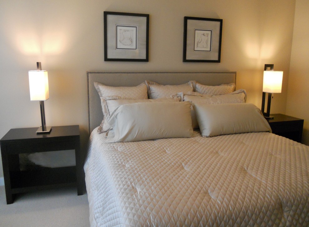 This is an example of a mid-sized contemporary master bedroom in Chicago with beige walls, carpet and beige floor.
