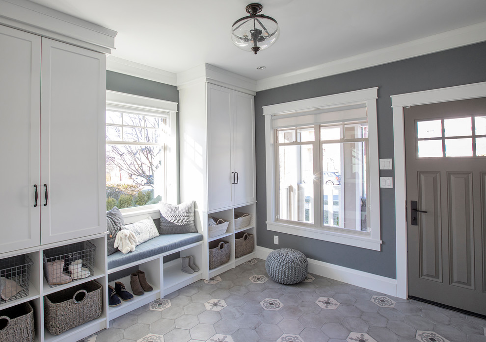 Mid-sized transitional mudroom in Edmonton with grey walls, a single front door and a brown front door.