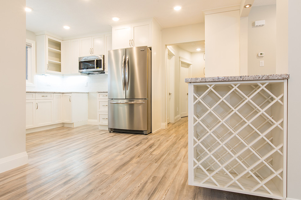 Transitional home design photo in Edmonton