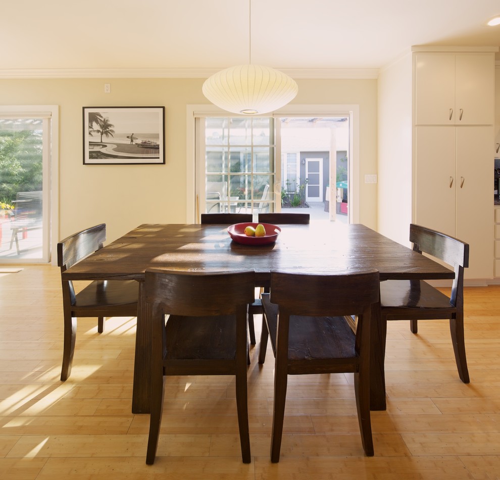 This is an example of a contemporary open plan dining in Los Angeles with bamboo floors.