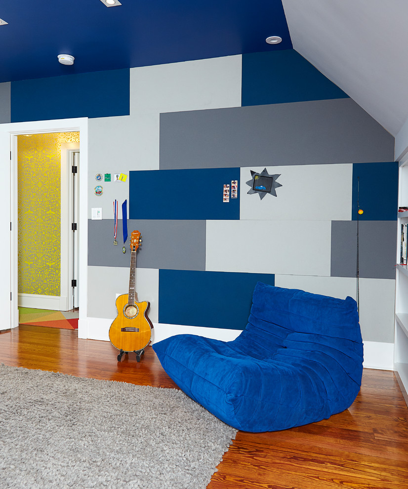 Inspiration for a large modern kids' room for boys in Wilmington with grey walls, medium hardwood floors and brown floor.