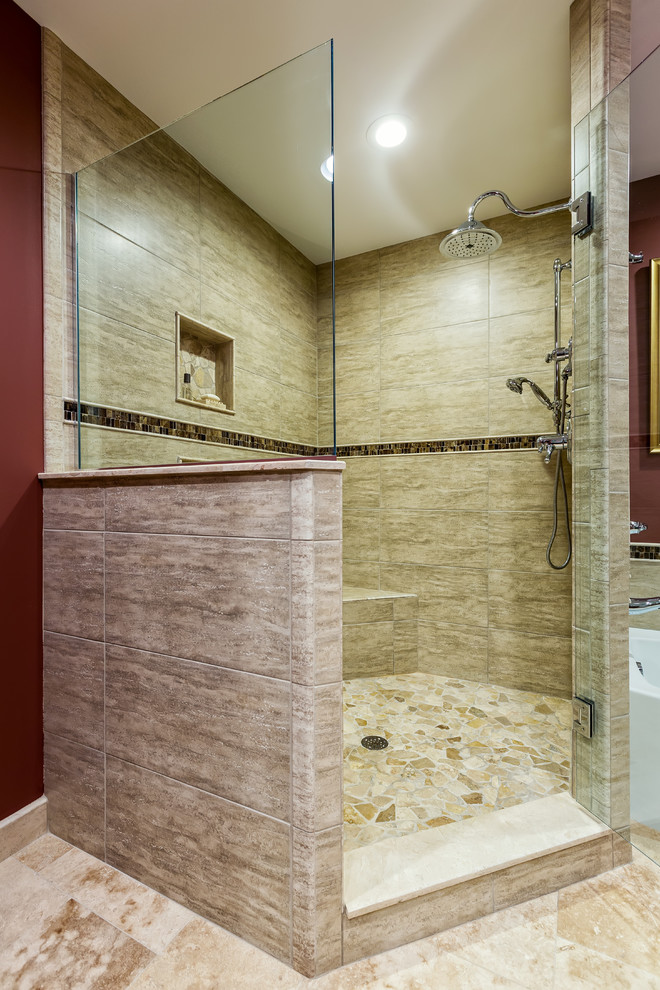 Design ideas for a large traditional master bathroom in Detroit with an undermount sink, shaker cabinets, medium wood cabinets, engineered quartz benchtops, an alcove tub, a corner shower, a two-piece toilet, multi-coloured tile, stone tile, red walls, travertine floors, beige floor and a hinged shower door.