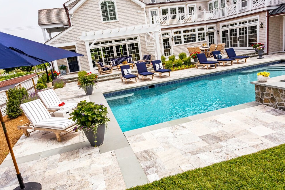 Example of a large transitional backyard stone and rectangular lap hot tub design