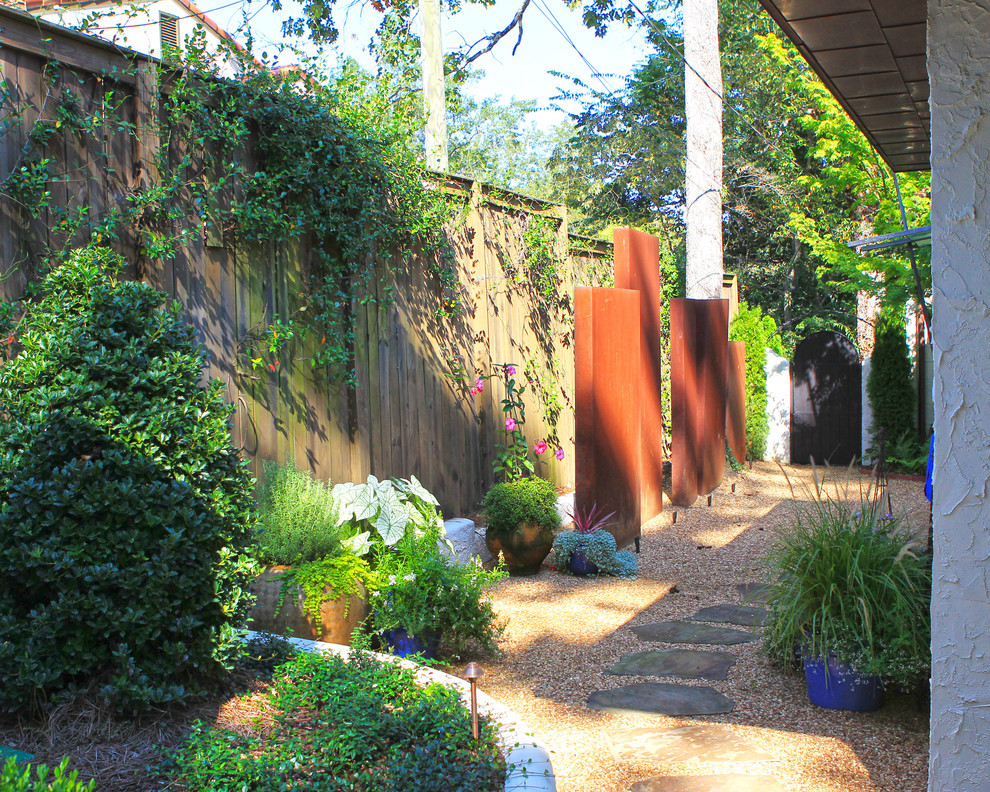 Inspiration for a mid-sized transitional partial sun backyard gravel formal garden in Birmingham.