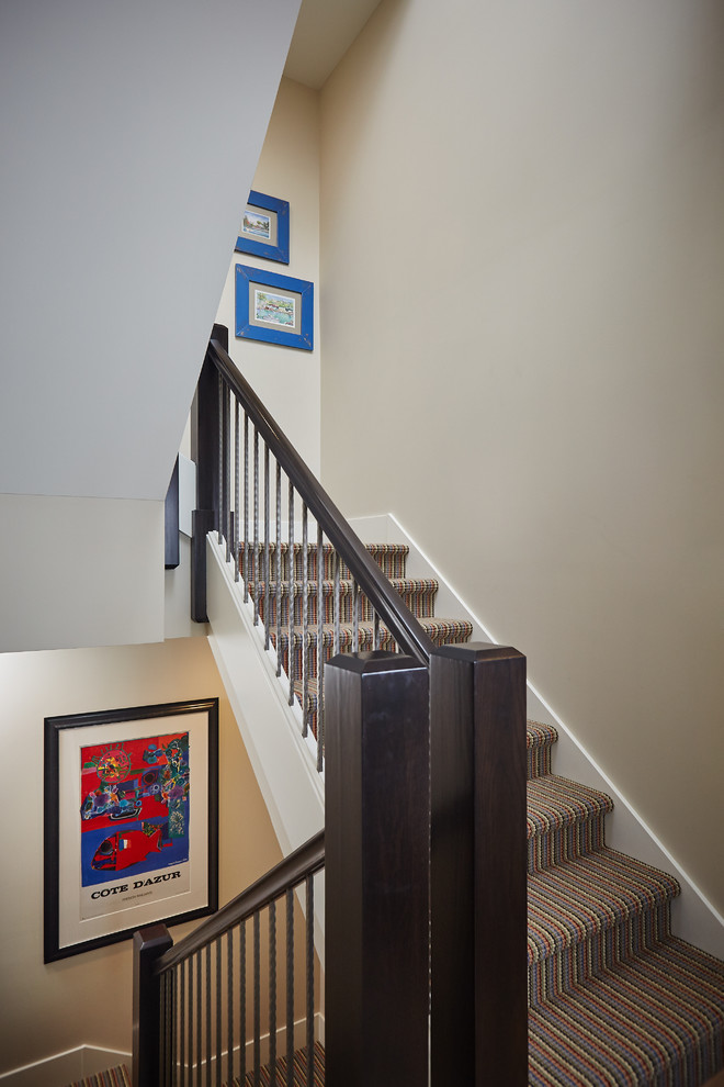 Example of a beach style staircase design in Grand Rapids