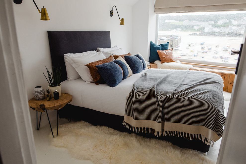 Inspiration for a small scandinavian master bedroom in Cornwall with white walls and white floor.