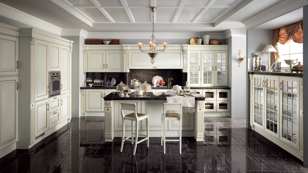 This is an example of an expansive traditional u-shaped eat-in kitchen in Melbourne with an undermount sink, raised-panel cabinets, white cabinets, quartzite benchtops, black splashback, stone slab splashback, stainless steel appliances, painted wood floors and multiple islands.