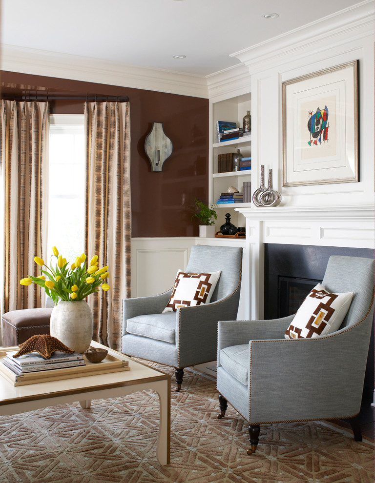This is an example of a traditional living room in Charlotte with brown walls.