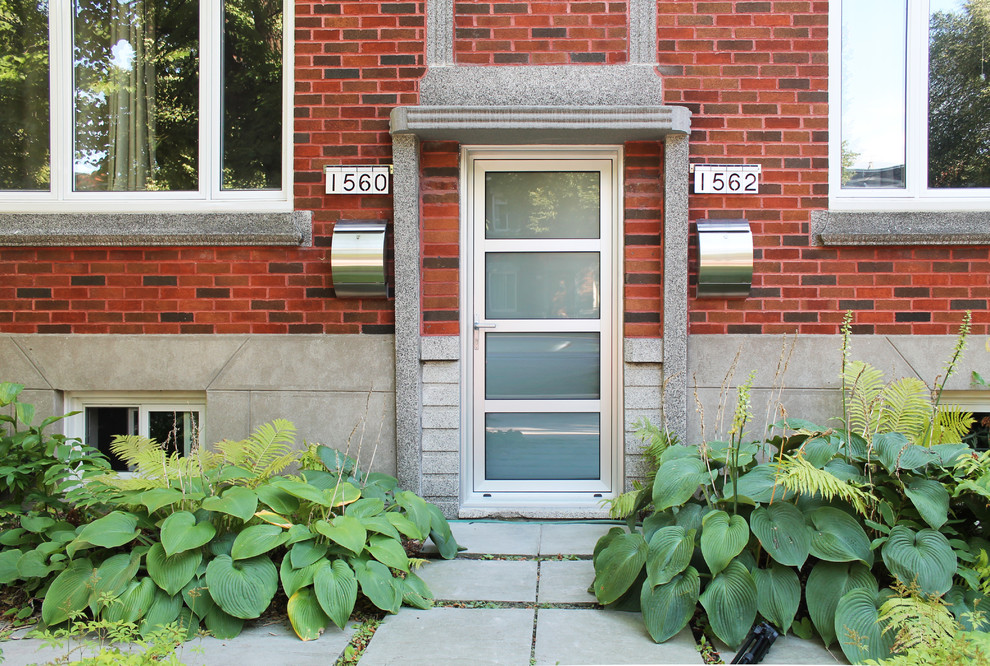 Design ideas for an eclectic front door in Montreal with a single front door and a metal front door.