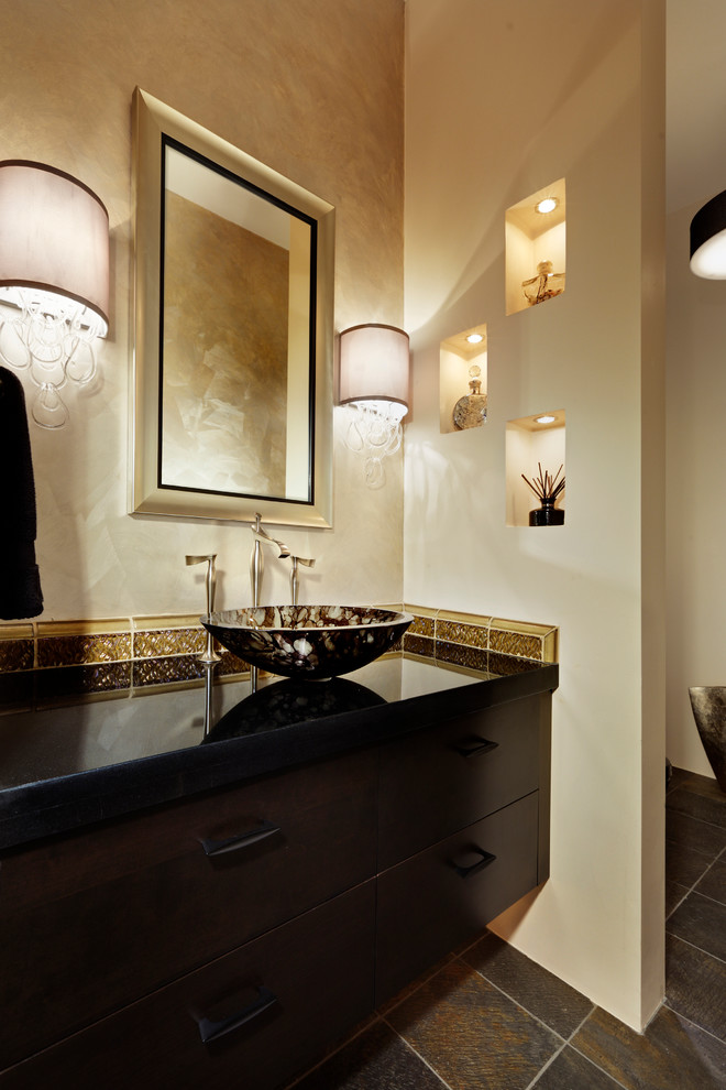 Inspiration for a mid-sized contemporary powder room in Sacramento with flat-panel cabinets, dark wood cabinets, a one-piece toilet, glass tile, multi-coloured walls, slate floors, granite benchtops and a vessel sink.