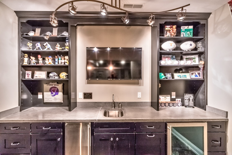 Large industrial u-shaped wet bar in Other with an undermount sink, shaker cabinets, black cabinets, concrete benchtops, grey splashback, ceramic floors, grey floor and grey benchtop.