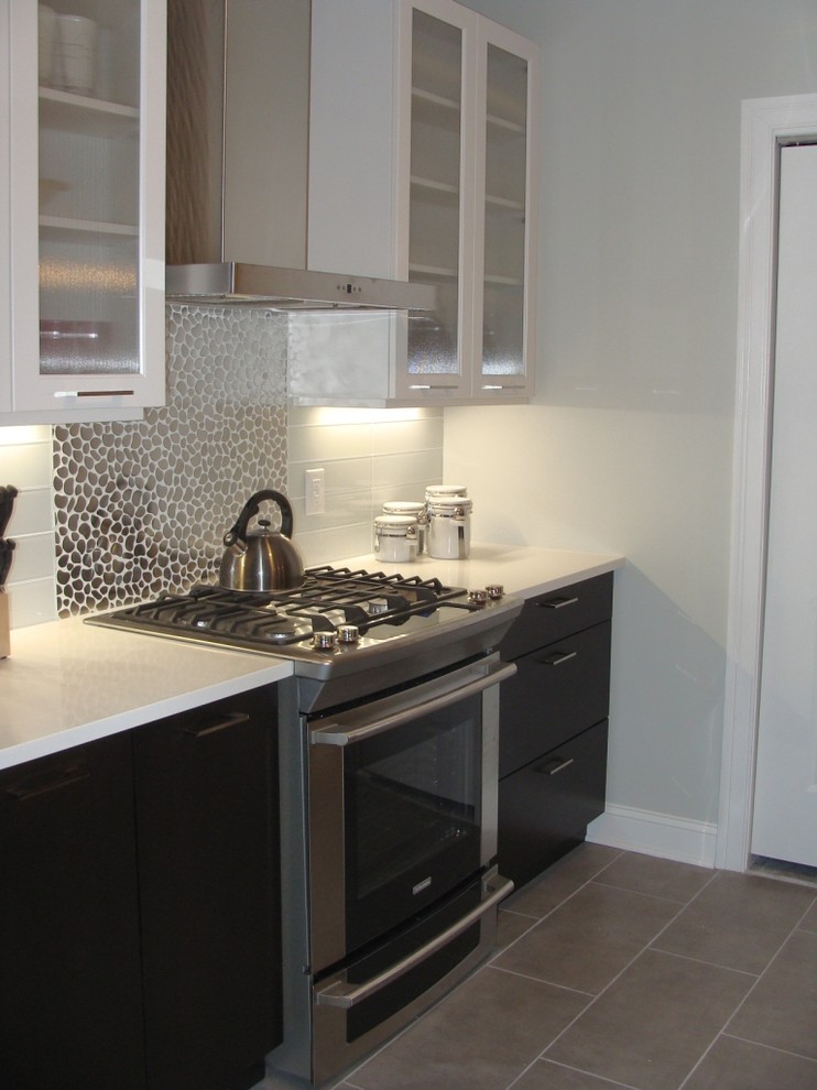 This is an example of a small contemporary galley eat-in kitchen in Boston with a single-bowl sink, flat-panel cabinets and quartz benchtops.