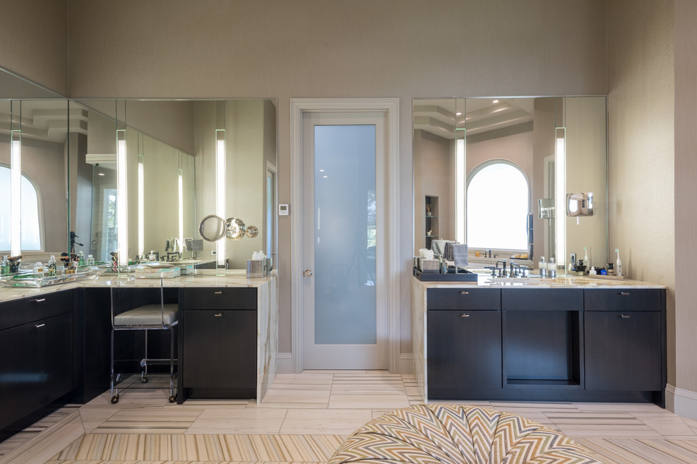This is an example of a large contemporary bathroom in Dallas with flat-panel cabinets, dark wood cabinets, a freestanding tub, beige tile, porcelain tile, beige walls, marble floors, an undermount sink, marble benchtops and with a sauna.