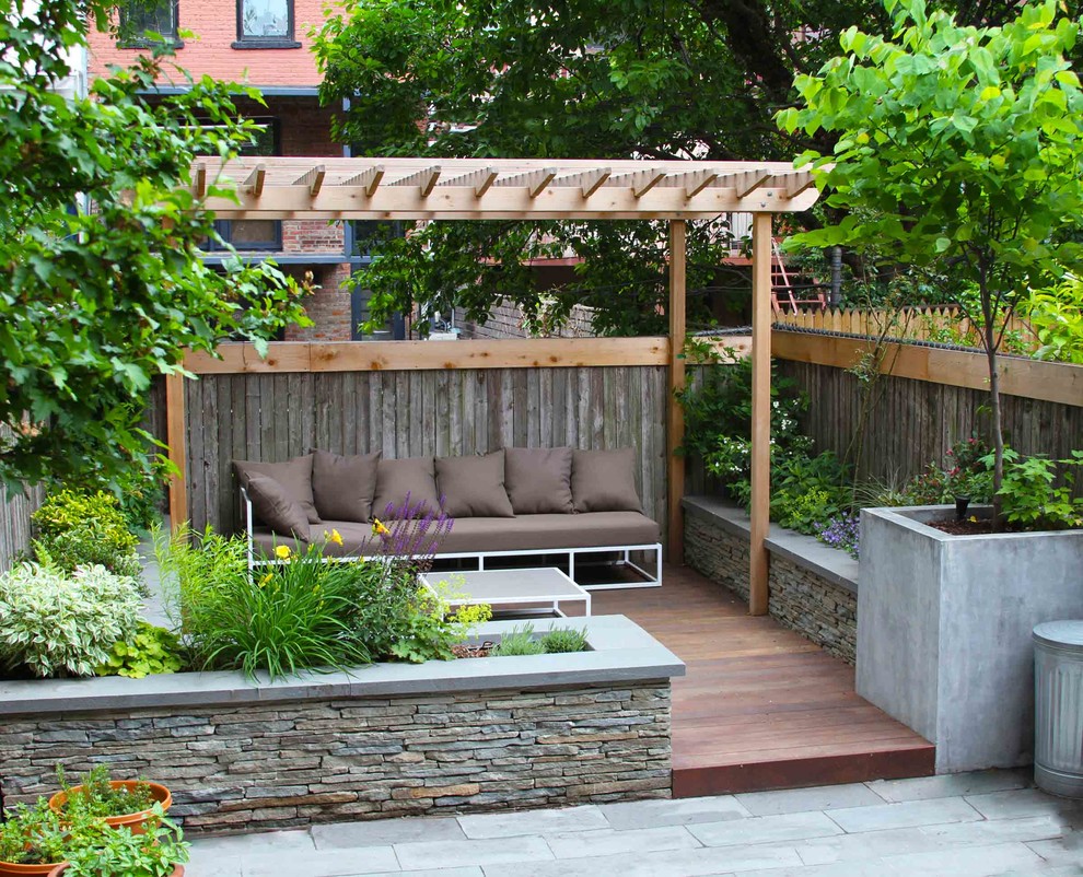 Traditional deck in New York with a pergola.