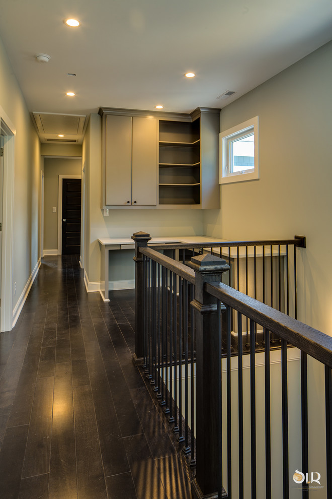 Example of a mid-sized transitional dark wood floor and brown floor hallway design with beige walls