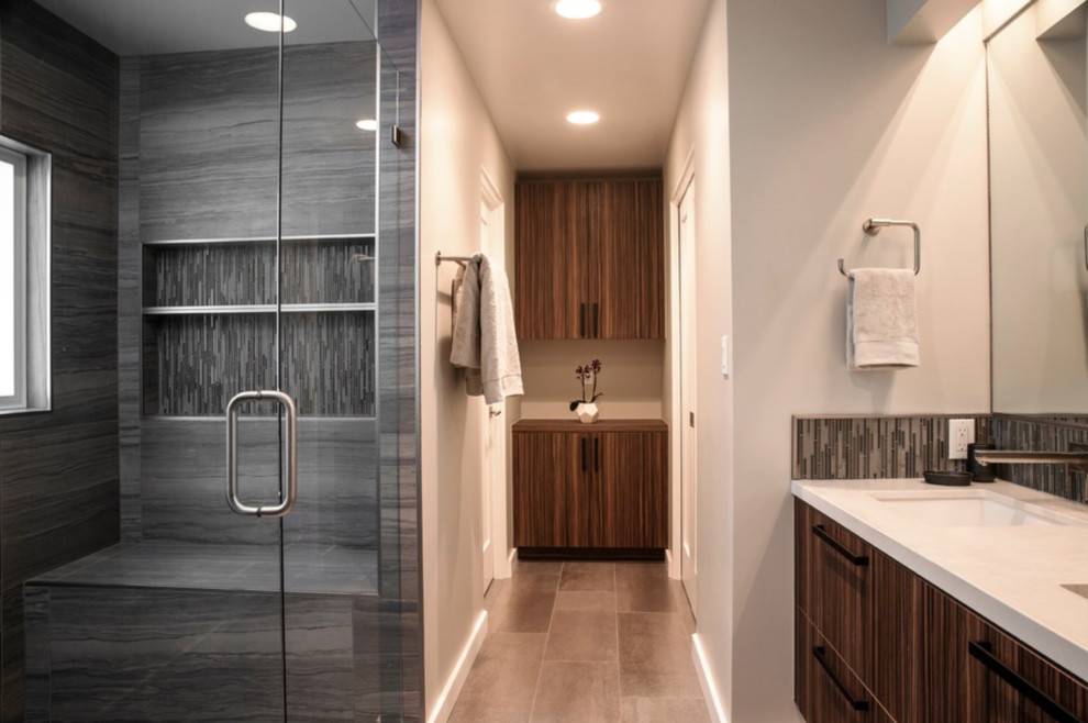 Mid-sized contemporary master bathroom in San Francisco with flat-panel cabinets, dark wood cabinets, an alcove shower, white walls, porcelain floors, an undermount sink and solid surface benchtops.