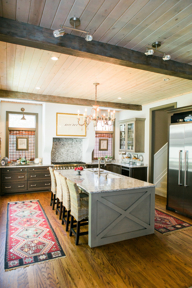 Example of a transitional medium tone wood floor kitchen design in Jacksonville with shaker cabinets, gray cabinets, quartz countertops, stainless steel appliances and an island
