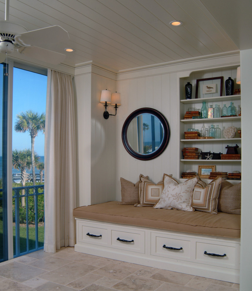 Design ideas for a mid-sized beach style foyer in Miami with white walls, light hardwood floors, a double front door, a black front door, brown floor, wood and panelled walls.