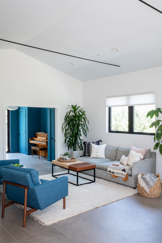 Inspiration for a mid-sized midcentury formal open concept living room in San Francisco with white walls, porcelain floors, no fireplace, grey floor, timber and vaulted.