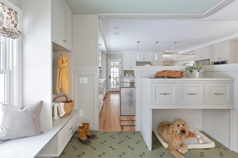 This is an example of a transitional mudroom in Minneapolis with white walls and green floor.