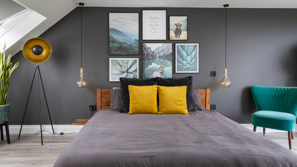 Contemporary bedroom in Essex with grey walls and grey floors.