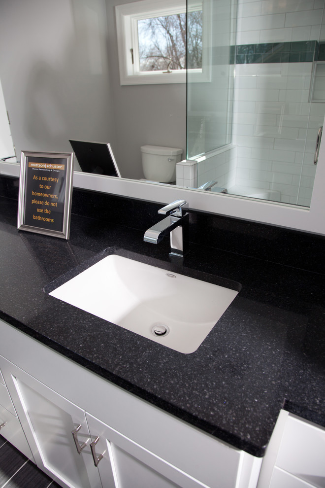 Inspiration for a small transitional master bathroom in Minneapolis with shaker cabinets, white cabinets, black and white tile, ceramic tile, grey walls, an undermount sink and granite benchtops.