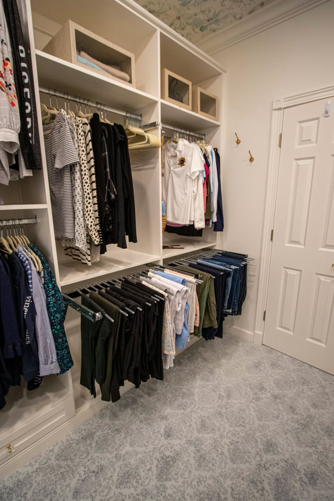 Inspiration for a medium sized classic walk-in wardrobe for women in Cleveland with flat-panel cabinets, white cabinets, carpet, grey floors and a wallpapered ceiling.