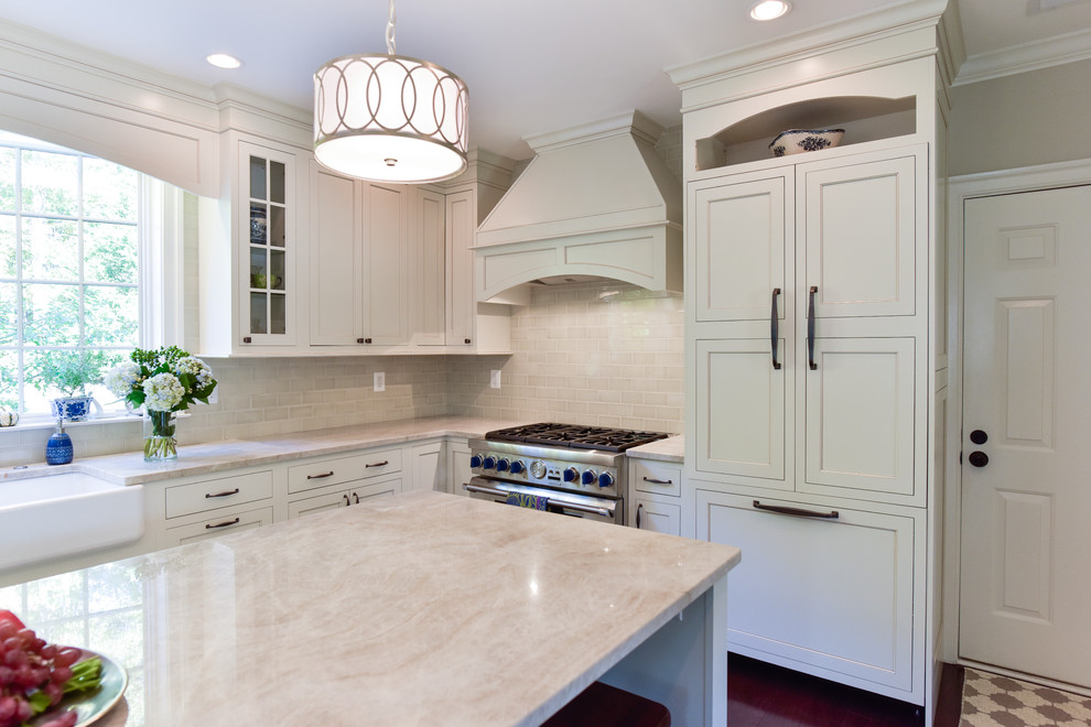 Photo of a large transitional l-shaped open plan kitchen in DC Metro with an undermount sink, beaded inset cabinets, white cabinets, quartz benchtops, beige splashback, subway tile splashback, panelled appliances, dark hardwood floors, with island and brown floor.