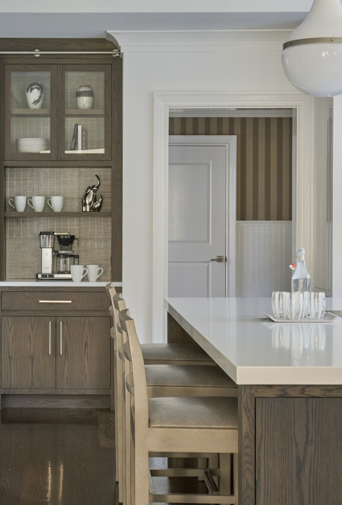 Enclosed kitchen - large transitional u-shaped dark wood floor and brown floor enclosed kitchen idea in New York with an undermount sink, flat-panel cabinets, dark wood cabinets, quartz countertops, white backsplash, mosaic tile backsplash, stainless steel appliances, an island and white countertops