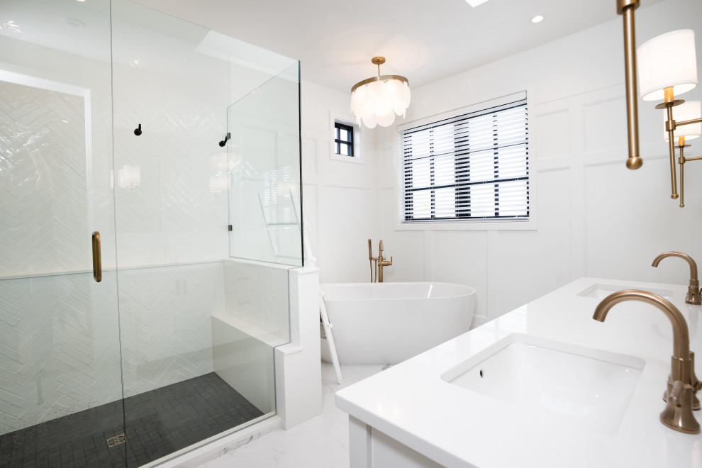 Freestanding bathtub - cottage master white tile and porcelain tile marble floor, white floor, double-sink and wall paneling freestanding bathtub idea in Vancouver with shaker cabinets, white cabinets, white walls, an undermount sink, quartz countertops, a hinged shower door, white countertops and a built-in vanity