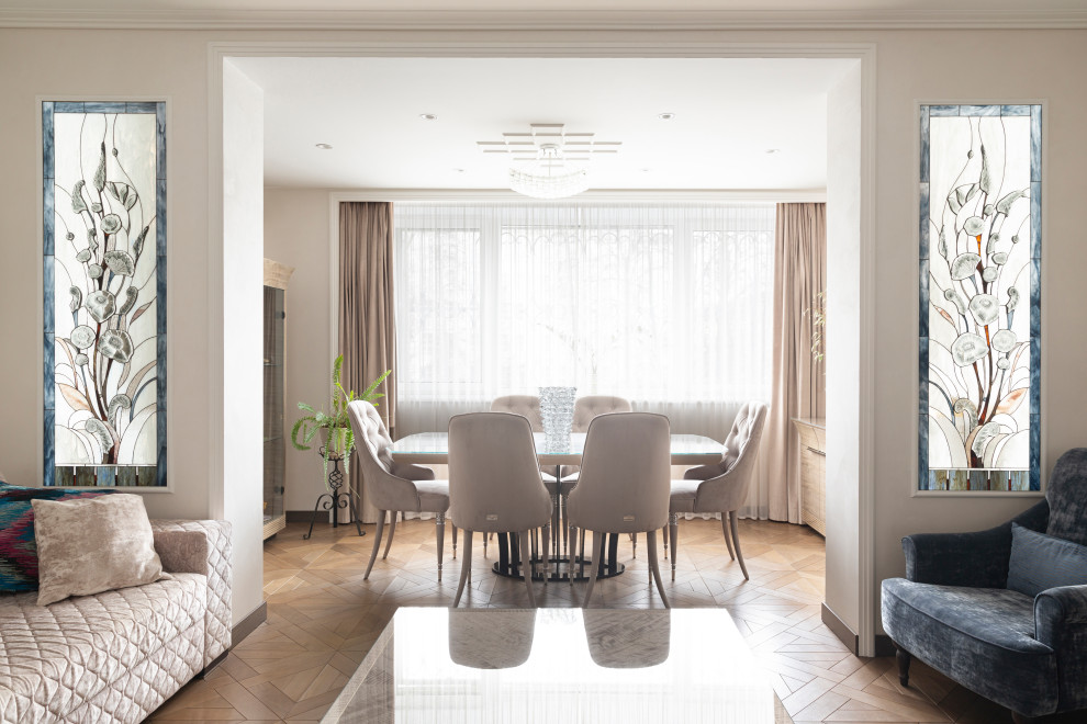 Inspiration for a transitional dining room in Moscow with beige walls, medium hardwood floors and brown floor.
