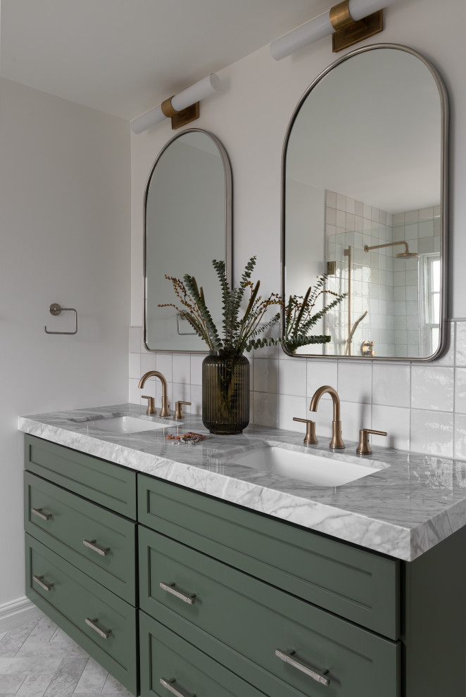 Inspiration for a medium sized modern ensuite bathroom in Detroit with shaker cabinets, green cabinets, an alcove shower, a one-piece toilet, white tiles, ceramic tiles, white walls, marble flooring, a submerged sink, quartz worktops, grey floors, a hinged door, grey worktops, a wall niche, double sinks and a built in vanity unit.