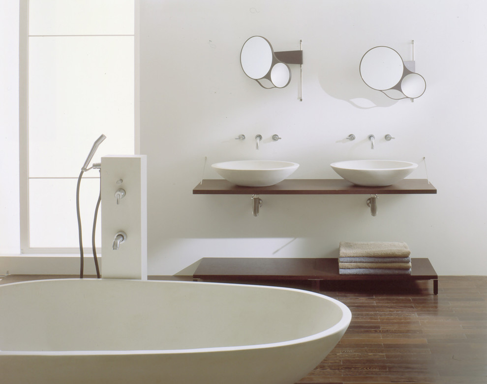 Inspiration for a contemporary master bathroom in San Francisco with a vessel sink, open cabinets, wood benchtops, a freestanding tub, brown tile, white walls and medium hardwood floors.