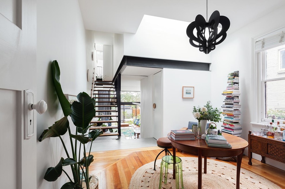 Design ideas for a mid-sized modern wood straight staircase in Sydney with open risers.