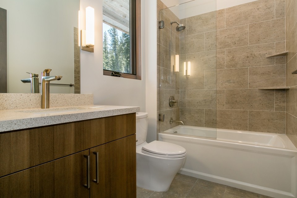Design ideas for a mid-sized country 3/4 bathroom in San Francisco with flat-panel cabinets, dark wood cabinets, an alcove tub, a shower/bathtub combo, a two-piece toilet, brown tile, porcelain tile, white walls, concrete floors, an undermount sink, concrete benchtops, brown floor and an open shower.