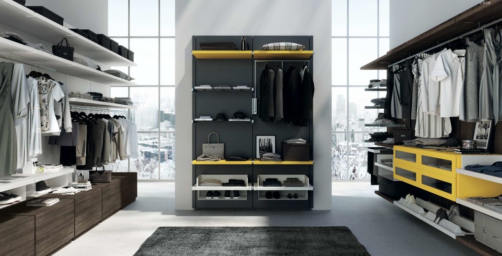 Mid-sized modern women's dressing room in Nice with open cabinets and yellow cabinets.
