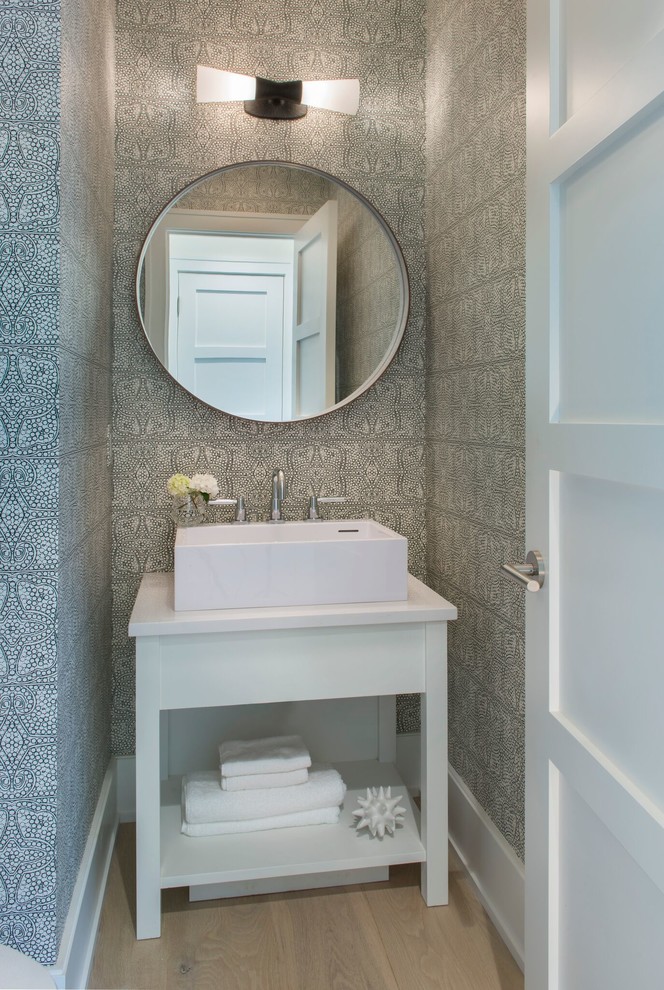 Photo of a mid-sized contemporary 3/4 bathroom in Providence with light hardwood floors and a vessel sink.