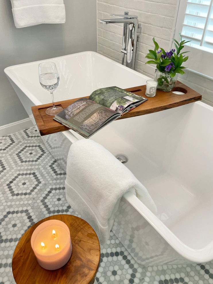 Inspiration for a medium sized traditional ensuite bathroom in DC Metro with shaker cabinets, grey cabinets, a freestanding bath, a corner shower, a two-piece toilet, white tiles, grey walls, mosaic tile flooring, engineered stone worktops, a hinged door, double sinks and a freestanding vanity unit.
