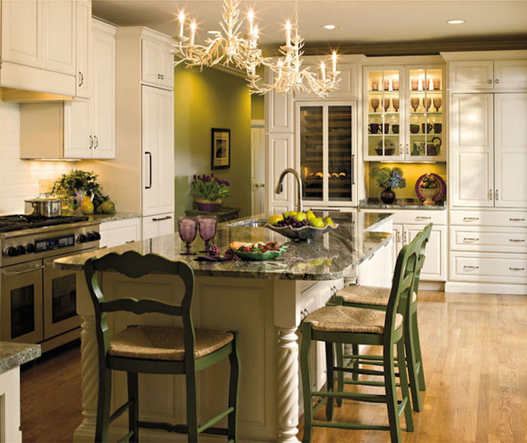 Example of a mid-sized transitional l-shaped dark wood floor and brown floor eat-in kitchen design in Orange County with an undermount sink, raised-panel cabinets, white cabinets, granite countertops, beige backsplash, ceramic backsplash, stainless steel appliances and an island
