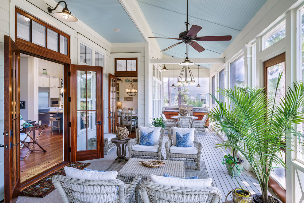 This is an example of a large beach style verandah in Atlanta with a roof extension.