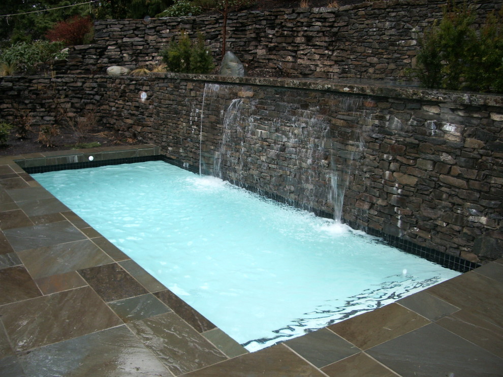 Pool - traditional backyard rectangular pool idea in Vancouver