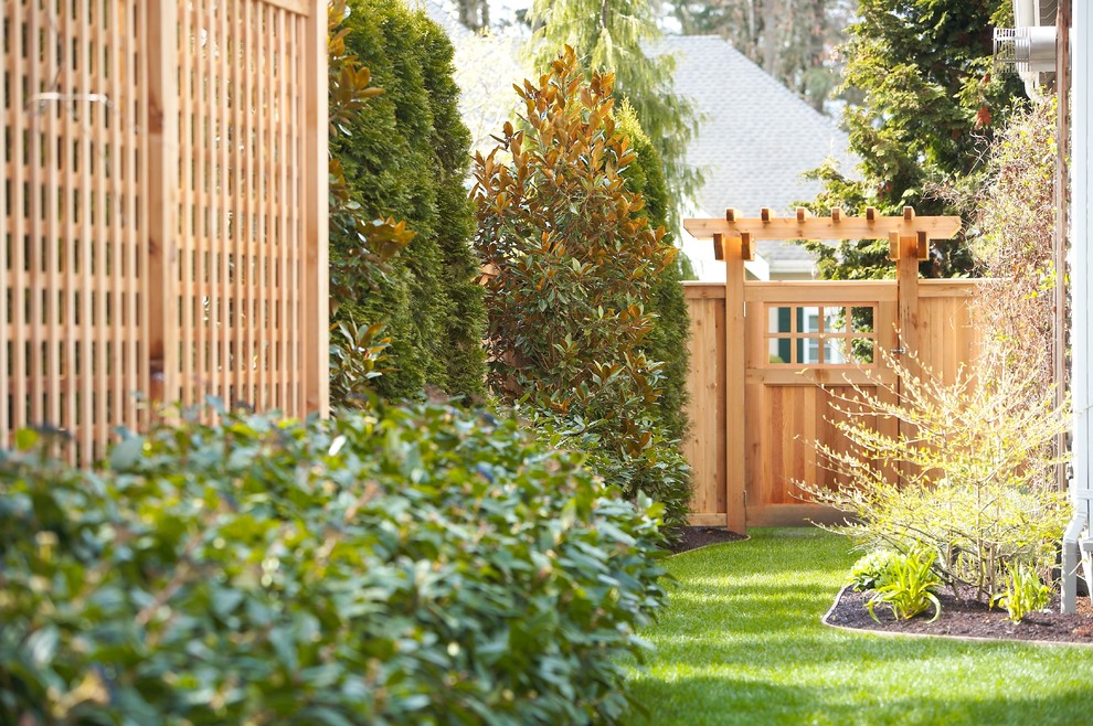 Inspiration for a mid-sized contemporary side yard partial sun garden for summer in Seattle with a garden path.